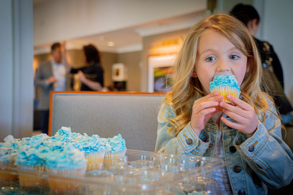 Little girl eats cupcake
